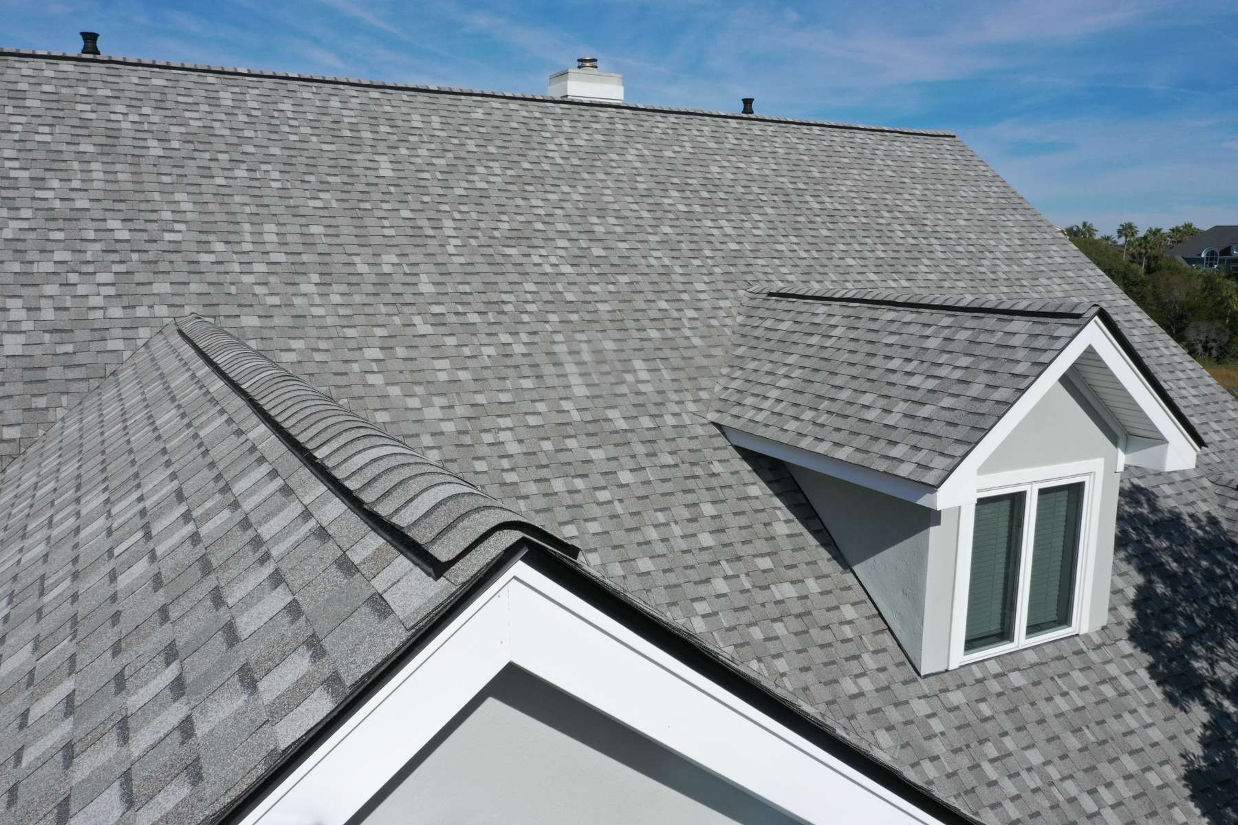 Roof with light gray shingles.
