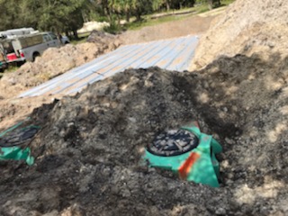 Excavation work being completed for a septic system.