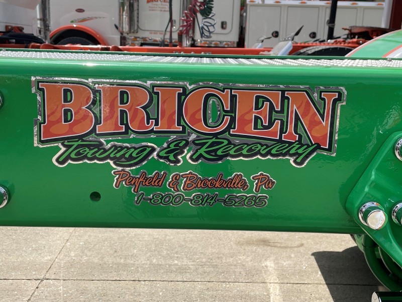 green Bricen sign on the side of a truck