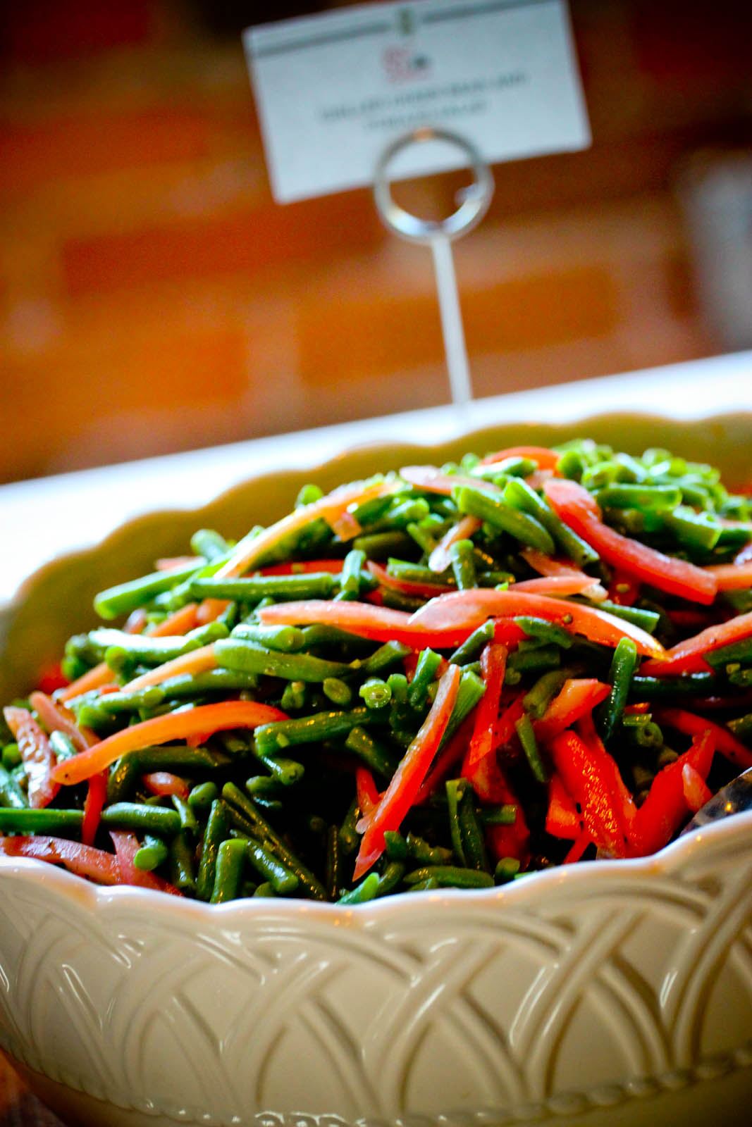 Close-up of green bean salad in a buffet line