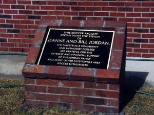 A plaque on a brick monument for Jeanne and Bill Jordan.