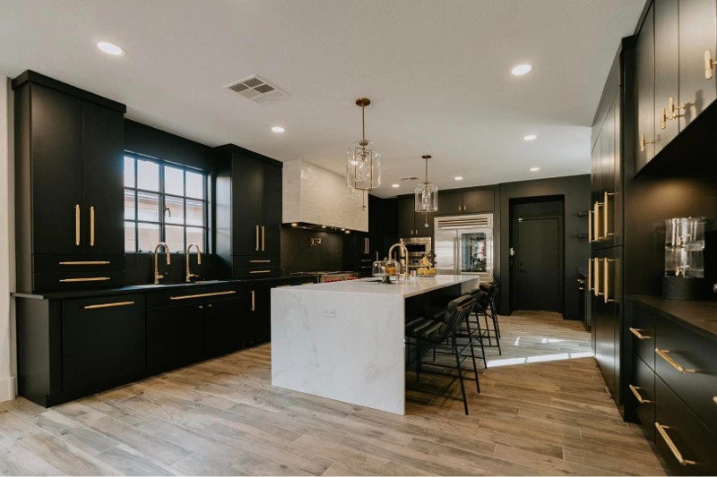 Kitchen with black cabinetry.