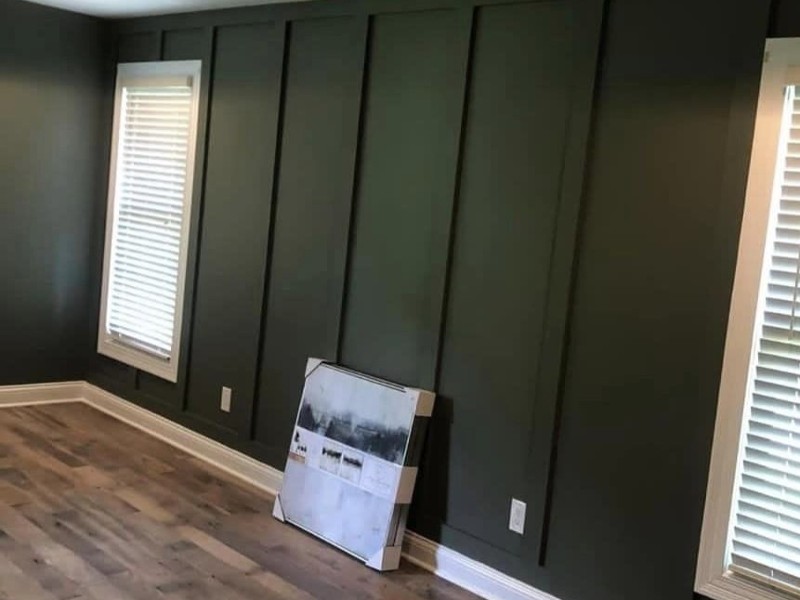 A newly painted room in dark green color.