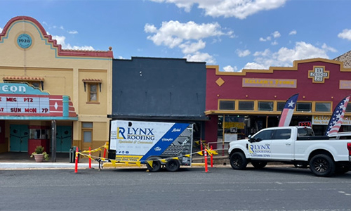 A row of three commercial businesses of different color.