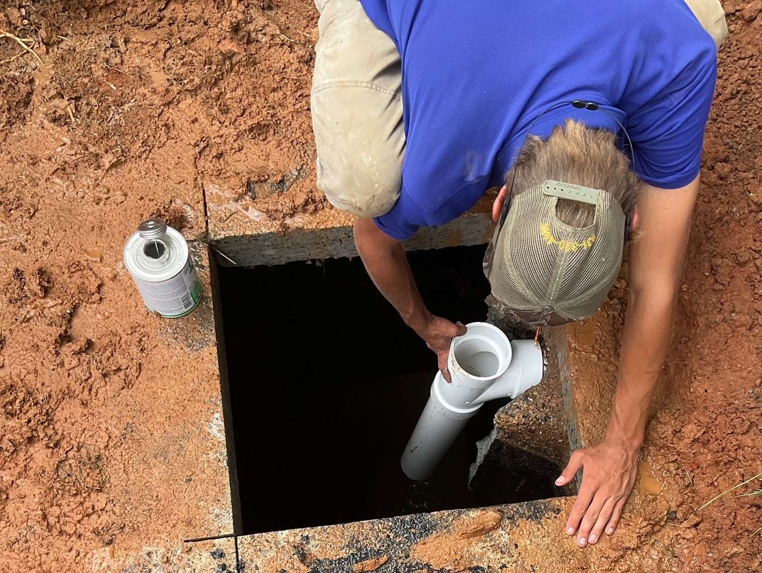 Man fixing septic system.