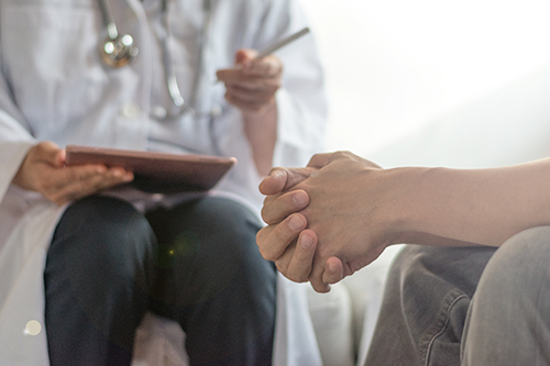 A group of people sit around a table for teacher and healthcare provider workshops