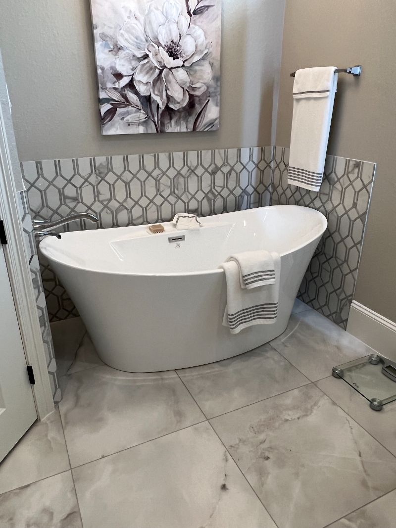 Tile surround and soaker bathtub