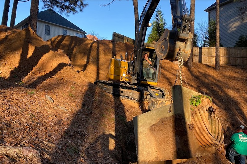 Man performs erosion repair.