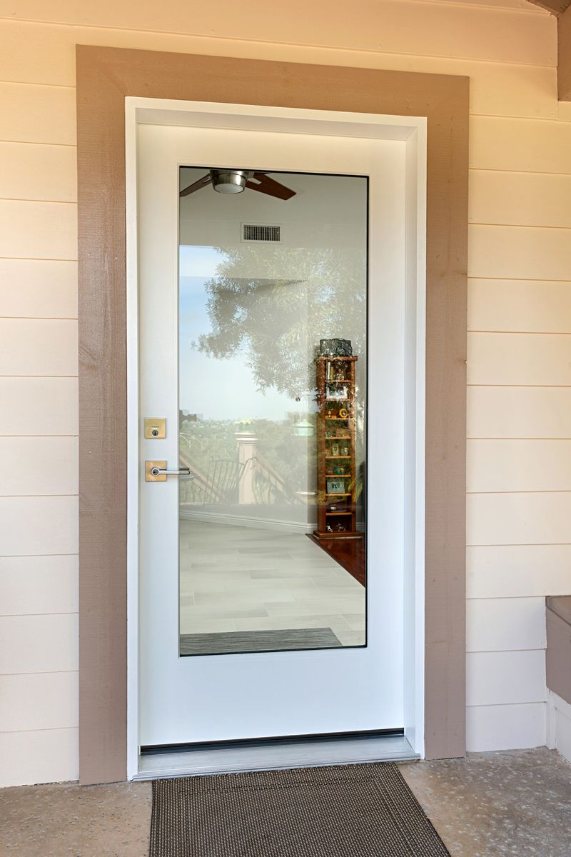 Front side of the glass door, showing locks and wooden trim