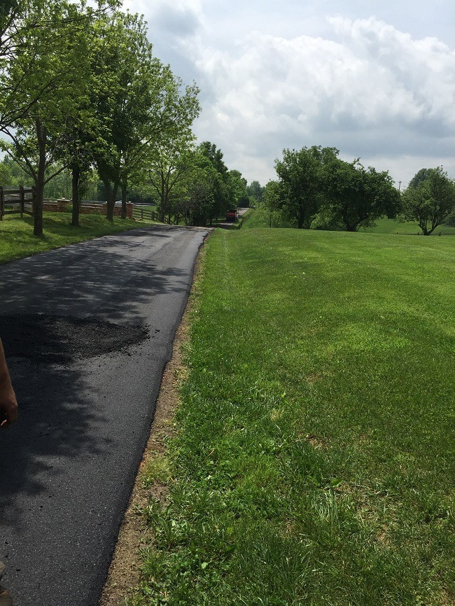 A newly paved asphalt roadway.