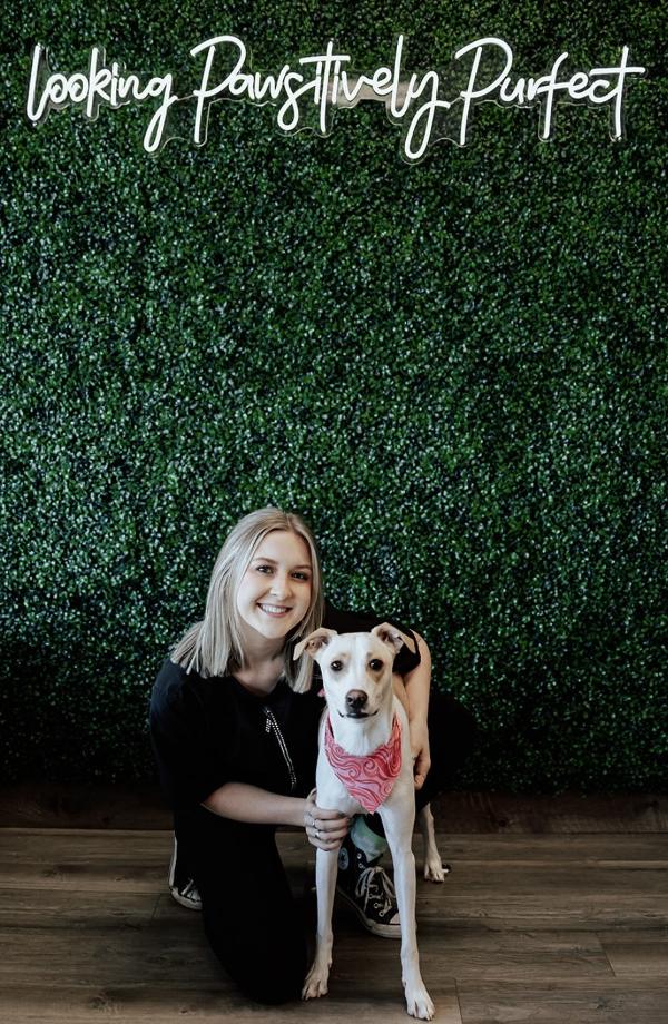 Cameryn posing with a dog