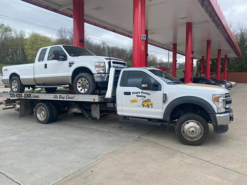 A car on the bed of a towtruck