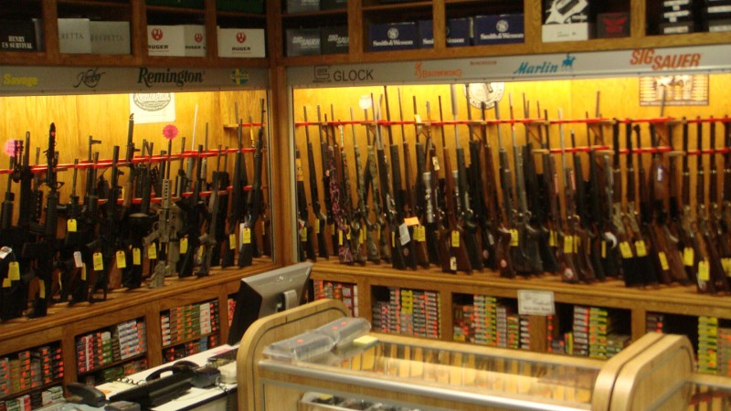 A display case of shotguns.