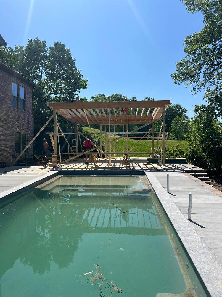 Pool with pool house being built.