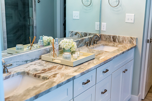 Marble bathroom vanity with a dual sink. 