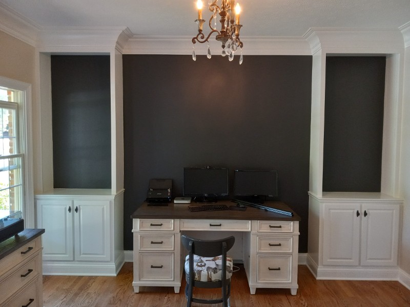 The wall of a home’s entertainment center with a fresh paint job.