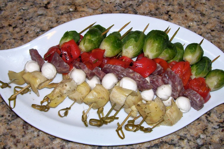 plate full of shish kabobs