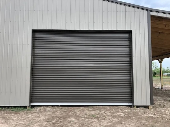 Single metal roll-up door on a metal outbuilding.