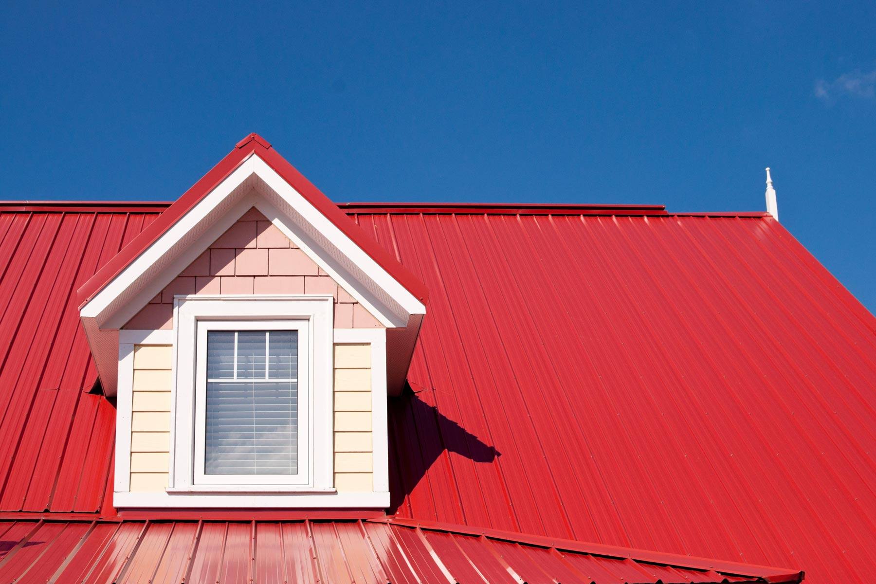 A house with a red metal roof