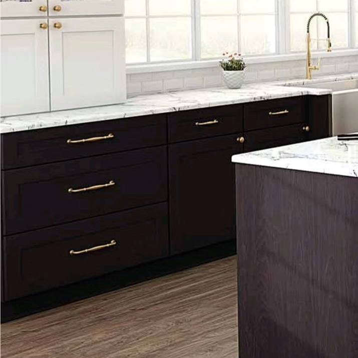 A stylish kitchen with white walls and uppers, dark lowers