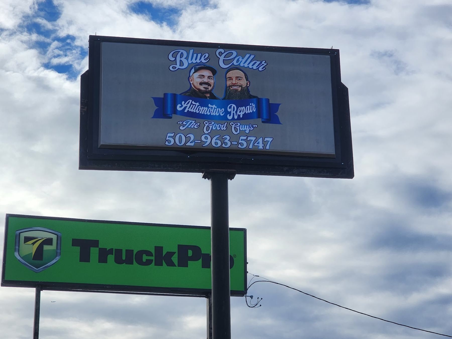 Billboard with the Blue Collar logo