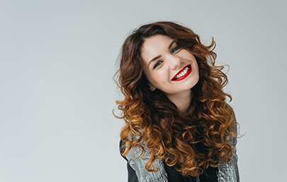  A young girl flashes a huge smile.