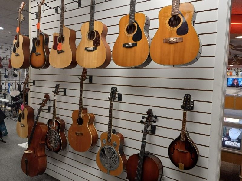 A wall of guitars and other string instruments