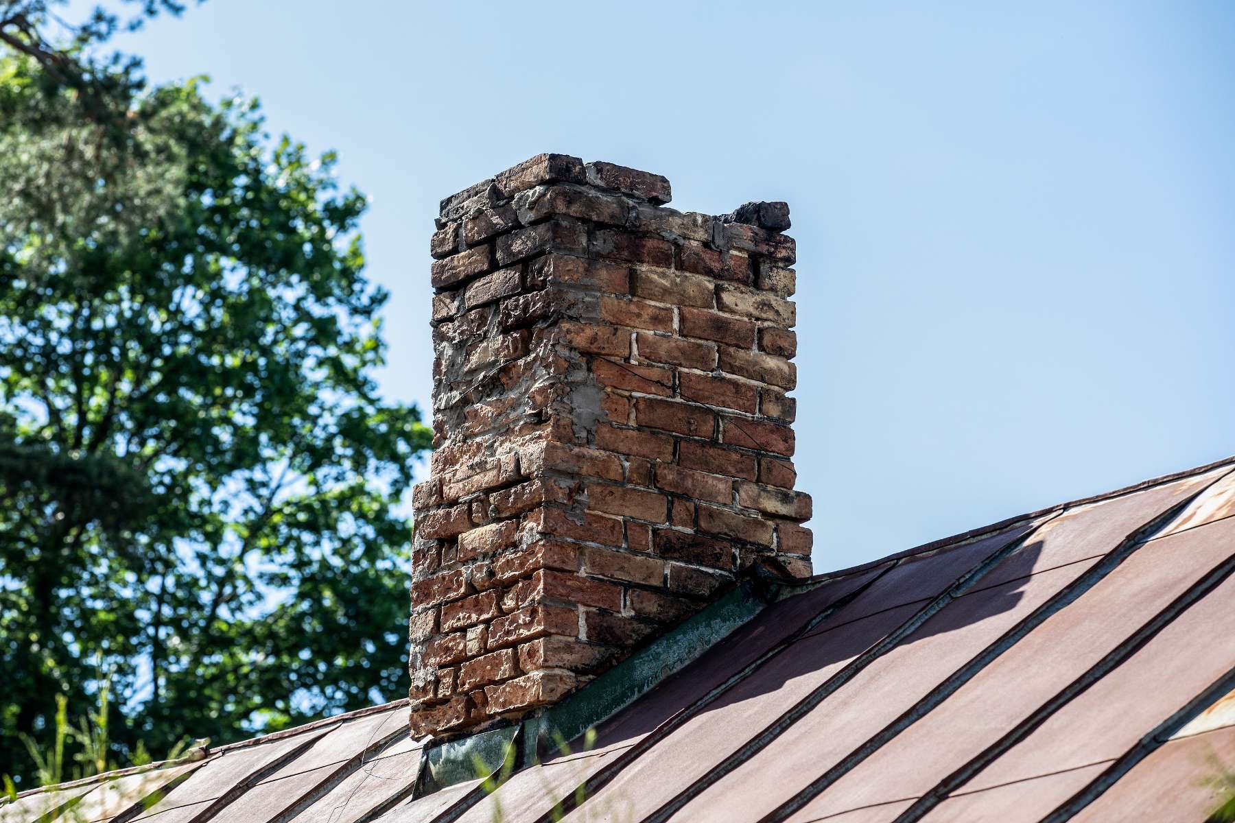 Old, damaged brick chimney