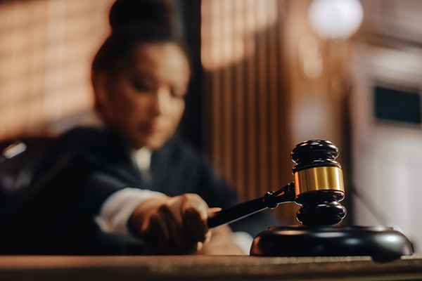 female judge lowering a gavel