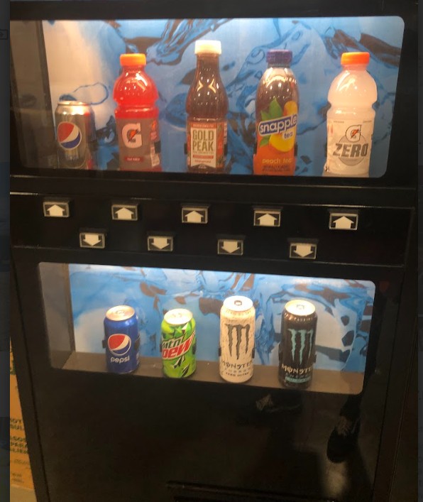 A variety of soft drinks fill a vending machine.