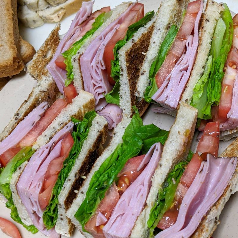 Two rows of club sandwiches.