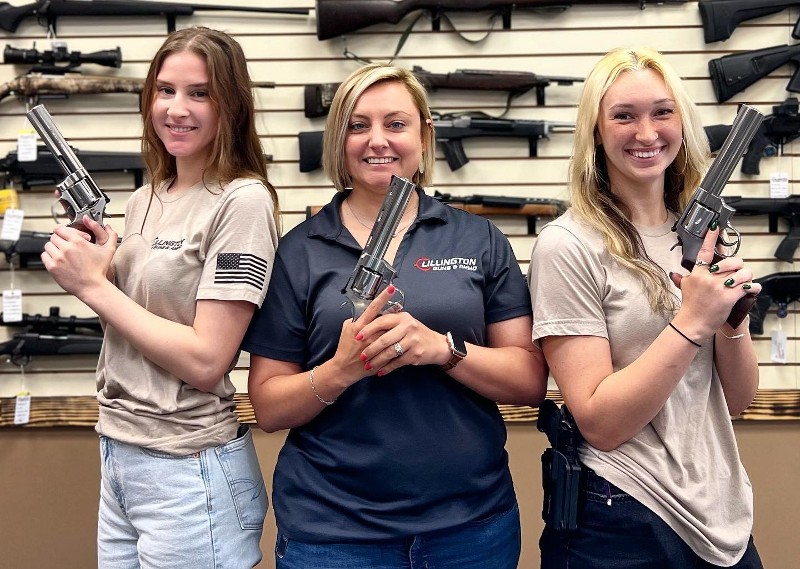 3 woman holding guns