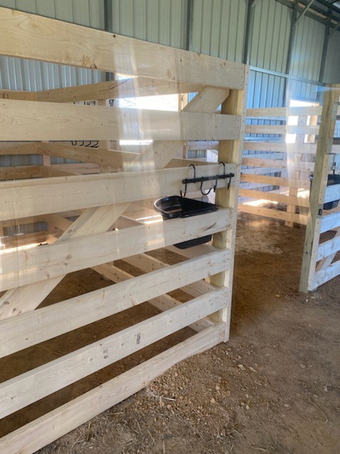 Newly constructed wooden horse stalls.