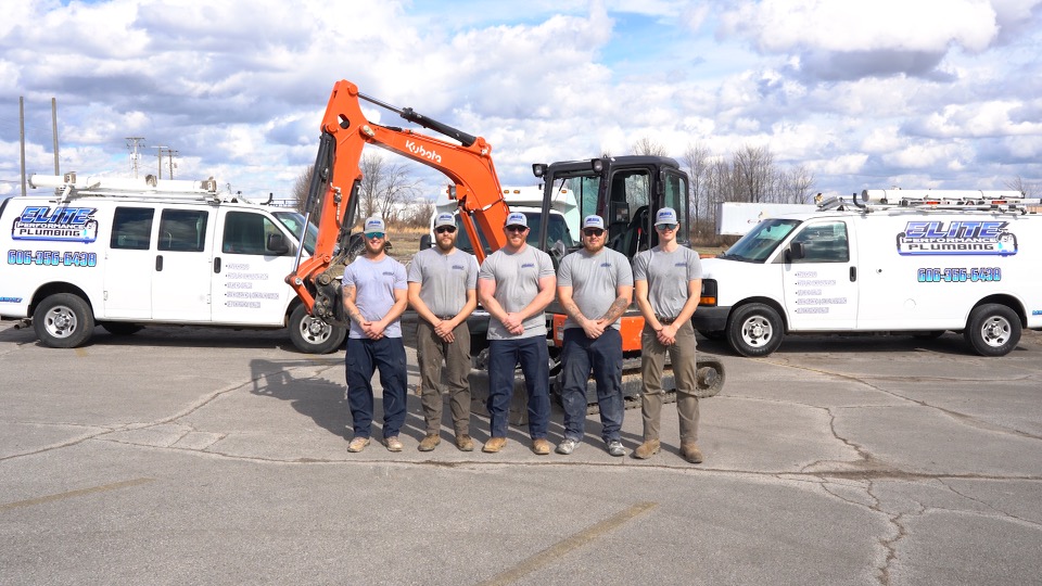 The team at Elite Performance Plumbing with their vans