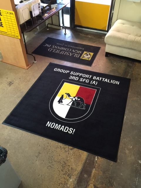 A square black rug for Nomads, Group Support Battalion 3rd SFG (A).