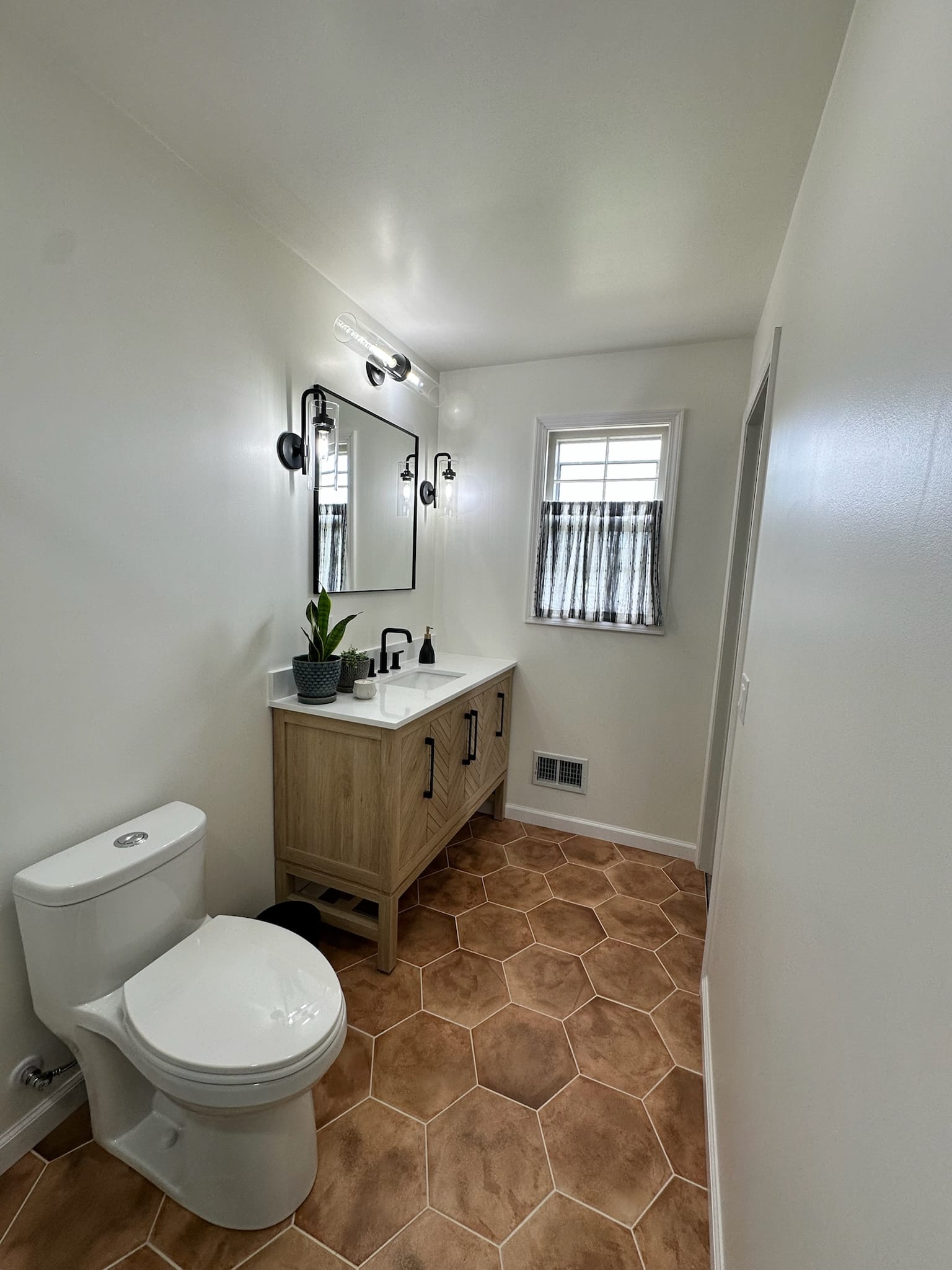 A modern tile shower with tile flooring.