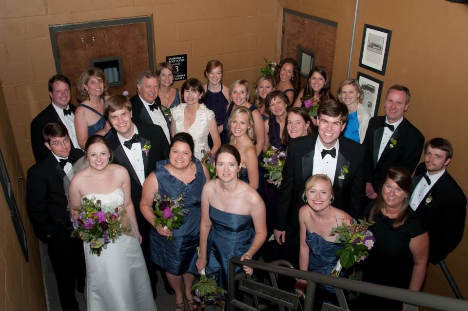 Newly weds with their family and close friends in a stairwell