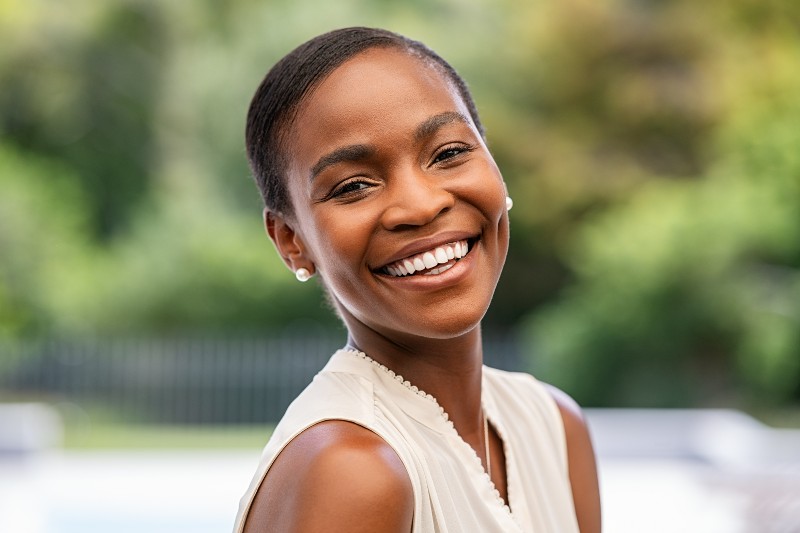 A woman smiling.