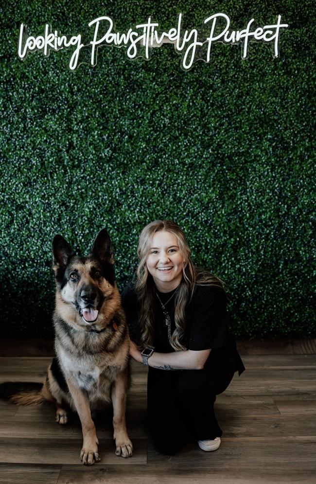 Kylie posing with a dog