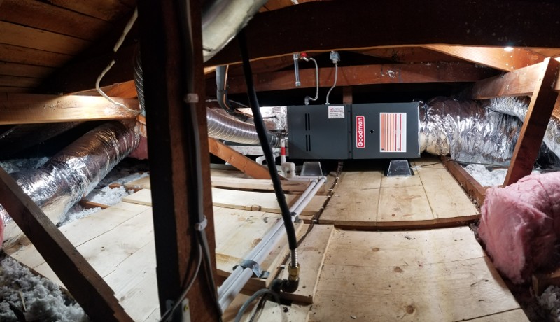 Goodman HVAC unit in an attic.