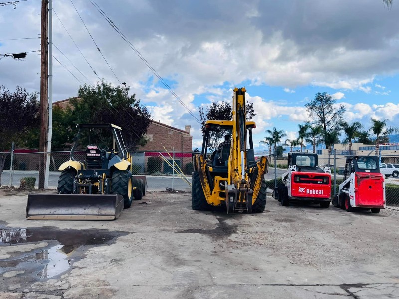 Four equipment rental vehicles.