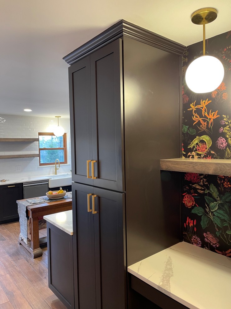 Handsome dark cabinety next to a cubby space with a coloful flower background.