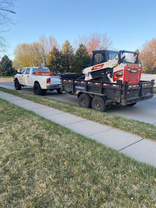 King Concepts truck and trailer, bob cat on trailer