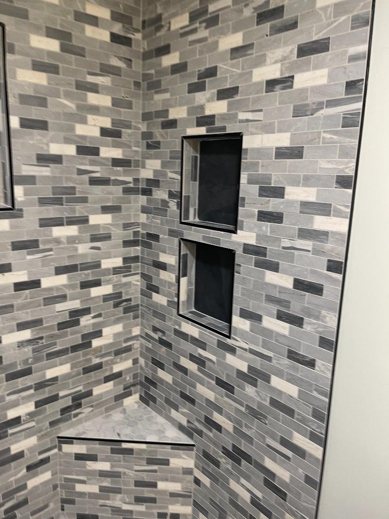 Tiled shower with recessed shelving