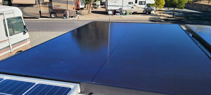 The view of an RV top with solar panels.