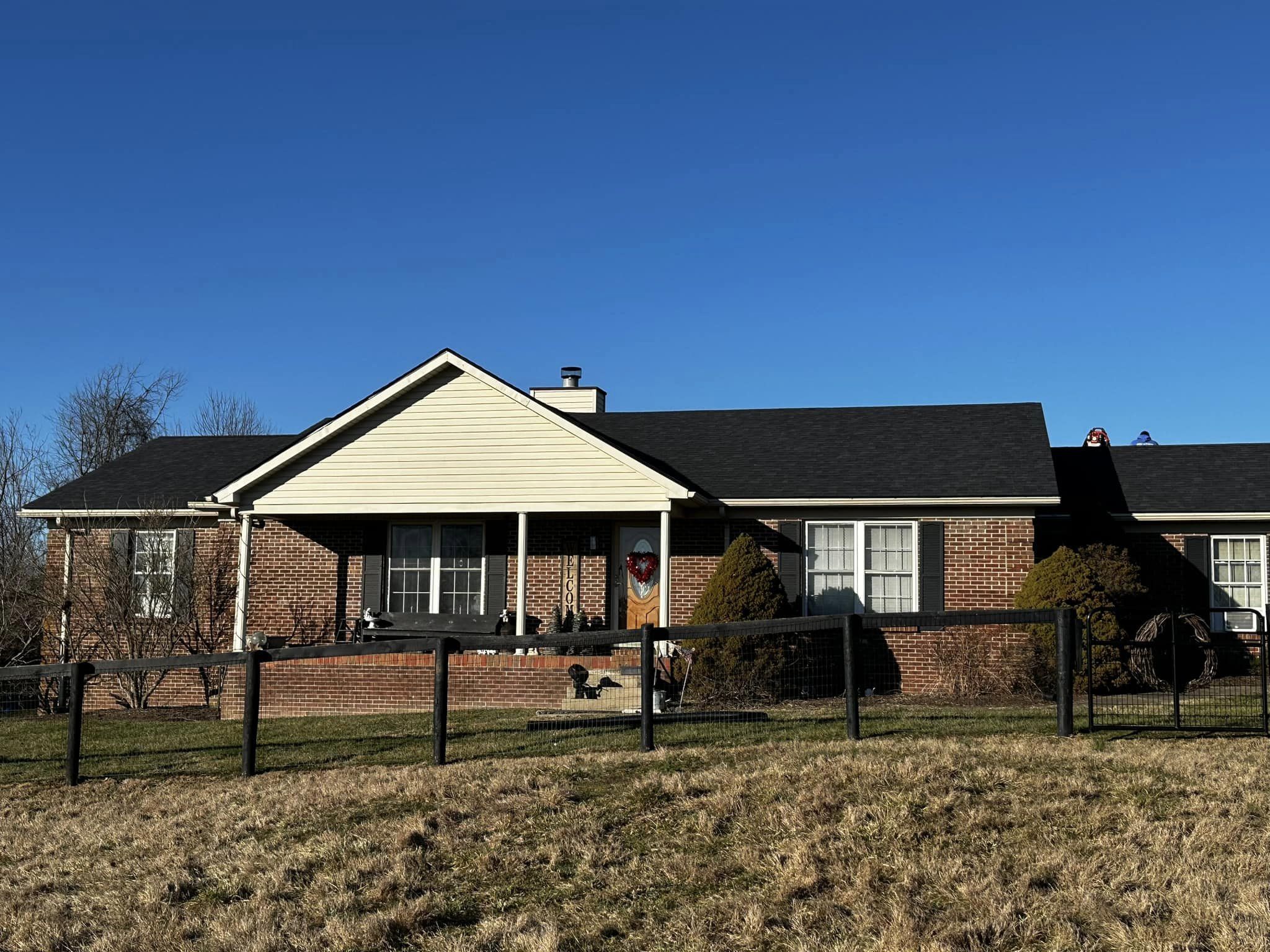 Single-story home with new roofing shingles.