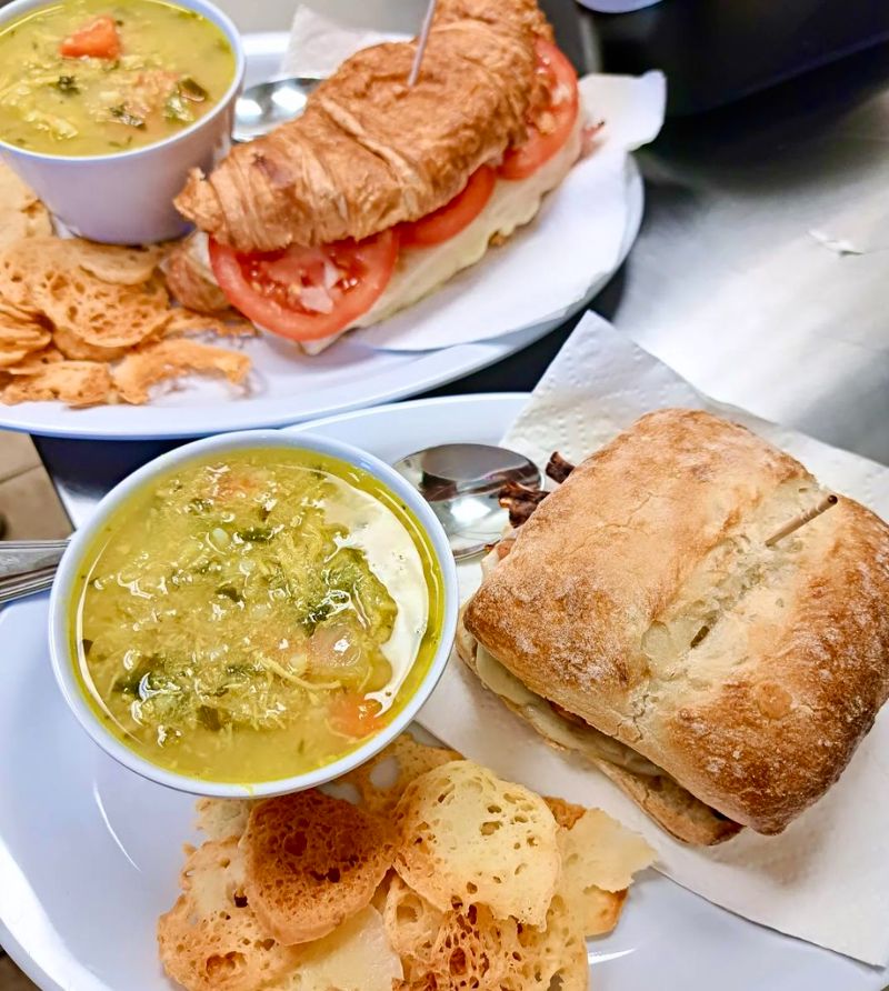 Plates of soups and sandwiches.