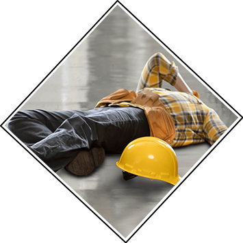 A worker lies on the floor, injured