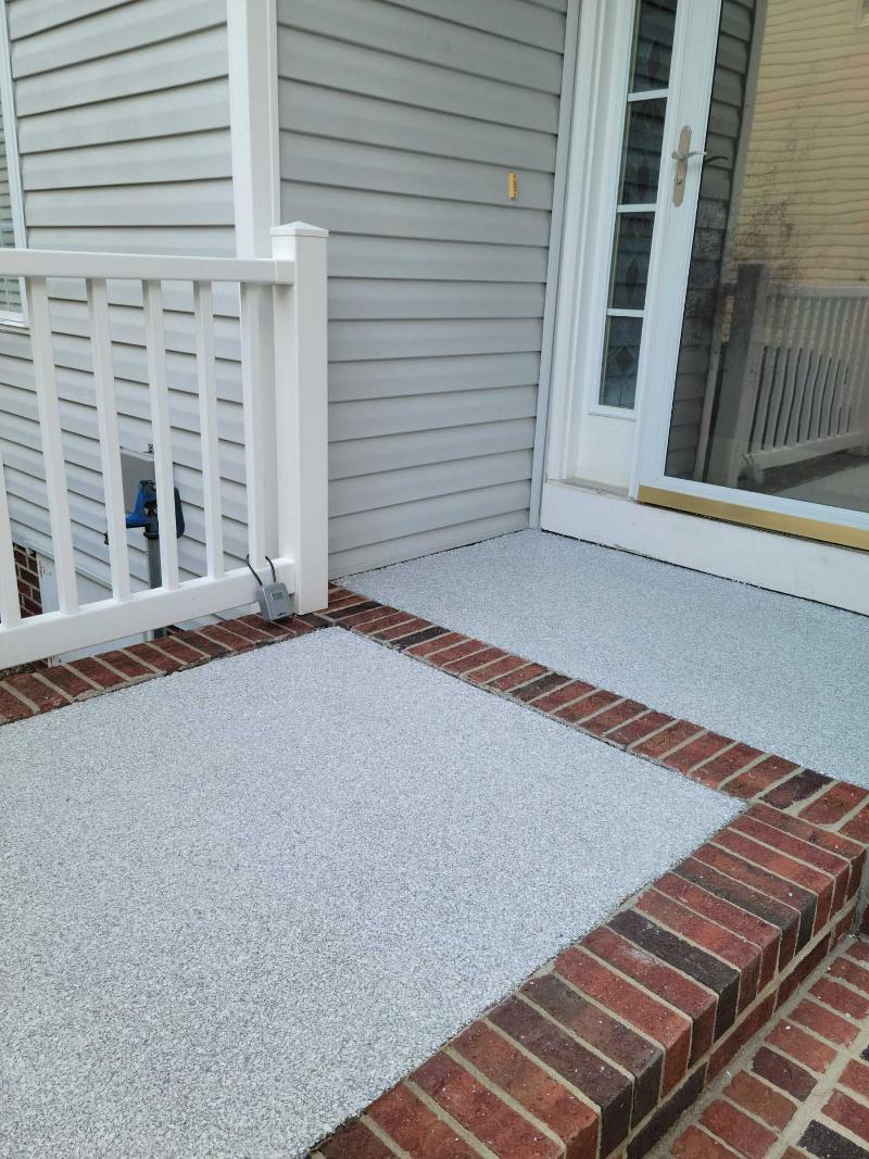 Steps to a home’s door with epoxy embedded in bricks.