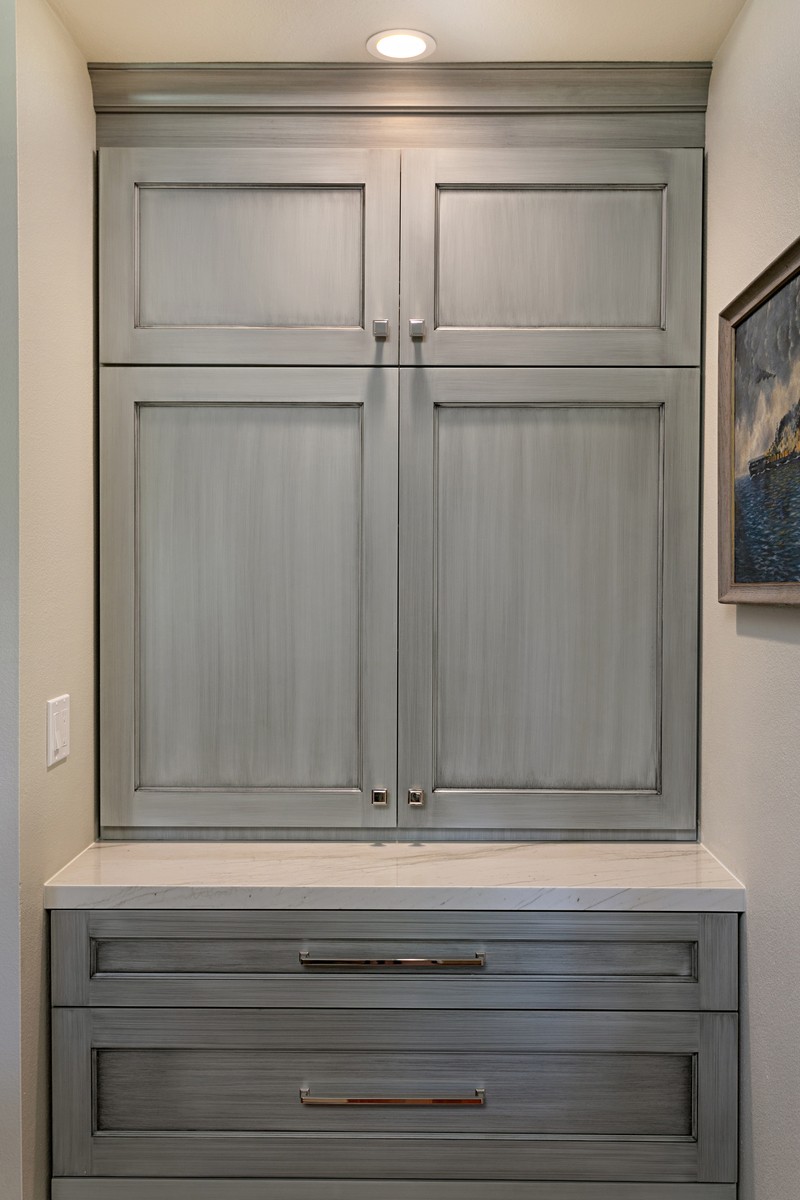Gray utility cabinets in a laundry room
